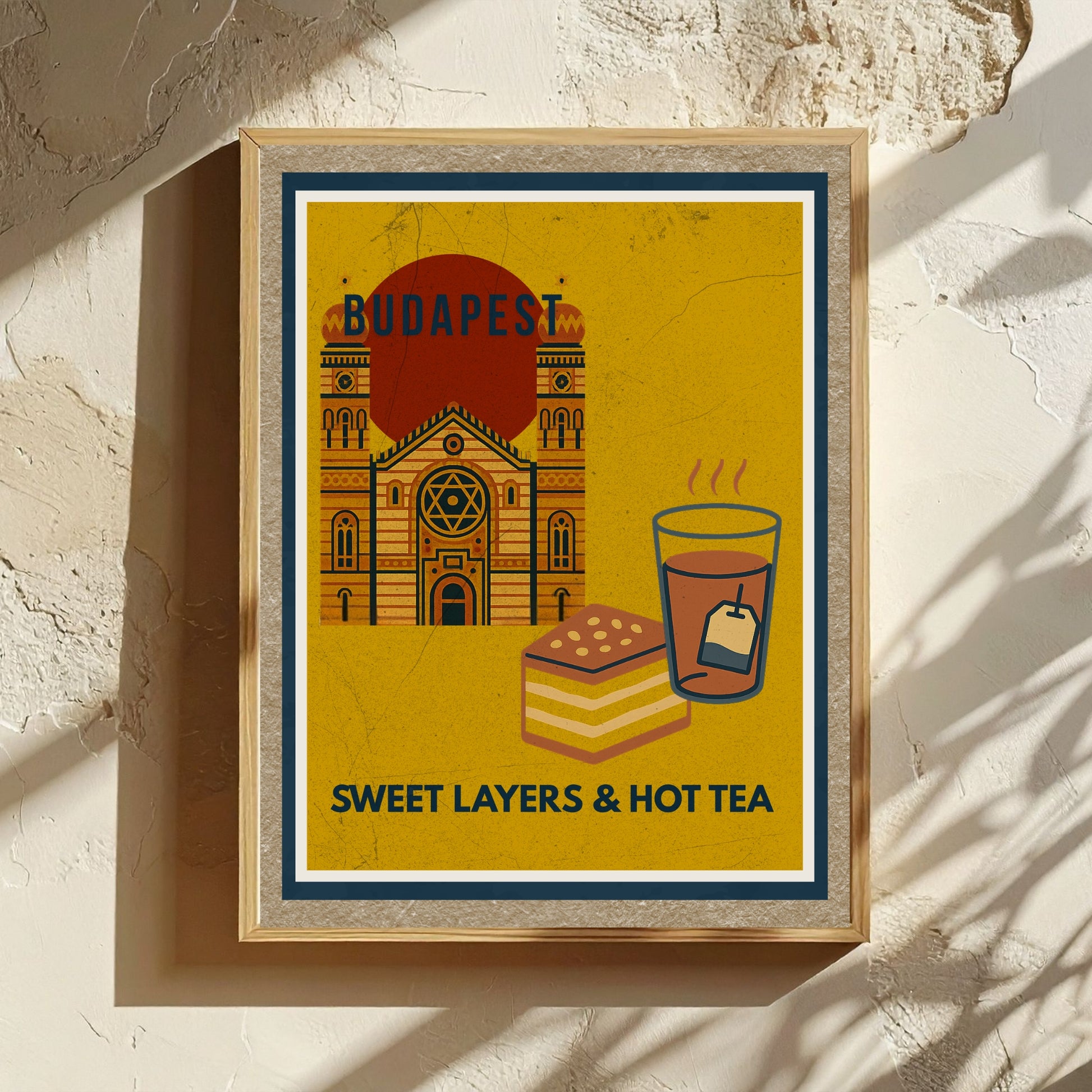 Sweet Layers & Hot Tea Budapest art print presented as a gift-ready flatlay on textured paper with natural decor elements and warm tones