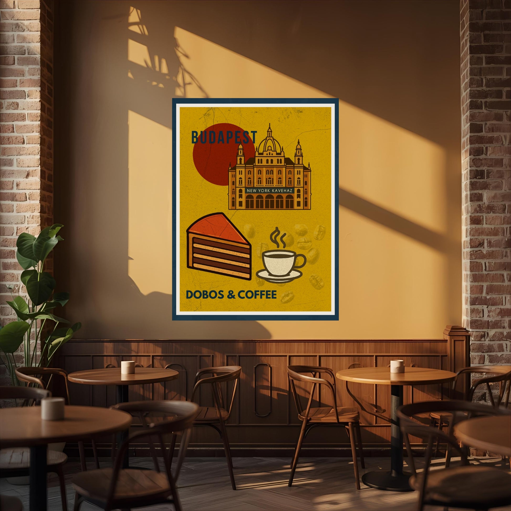 Dobos & Coffee Budapest poster displayed on a café wall, featuring the New York Café building, Dobos cake and a cup of coffee in a warm bistro interior.